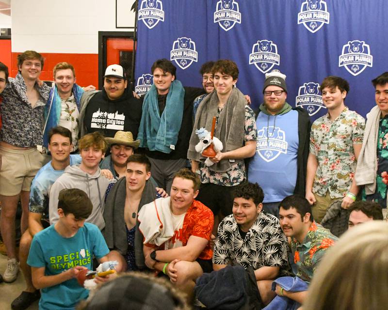Members of the Phi Kappa Psi pose for photo as they receive the award for most money raised by a team and Team Spirit Award on Saturday, Feb. 15, 2025, during the 2nd annual Polar Plunge at Northern Illinois University's Huskie Stadium in DeKalb.