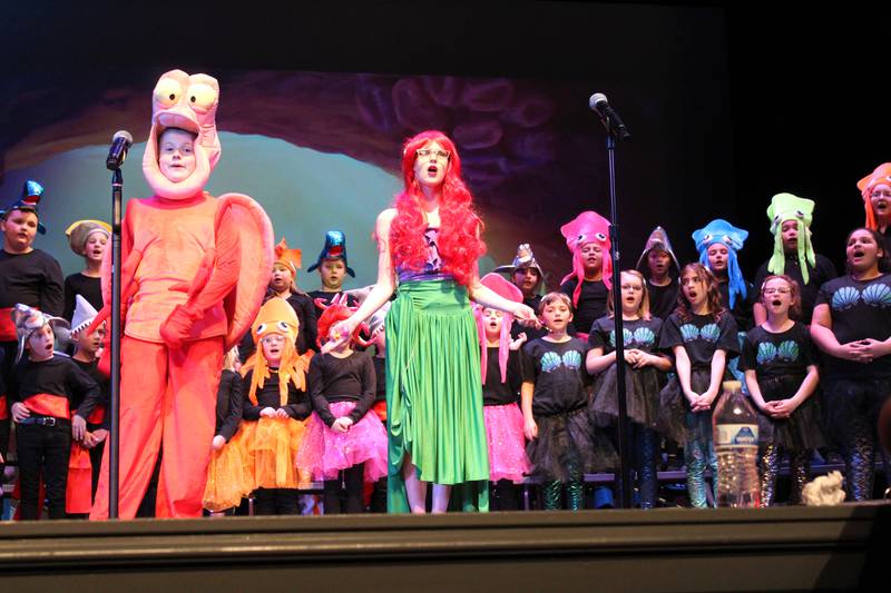 Sebastian (Karsyn Stewart) and Ariel (Piper Brandenburg) sing along with the chorus during the Streator Elementary Schools production of "The Little Mermaid Jr." Friday, May 5, 2023, at the Streator High School Auditorium.