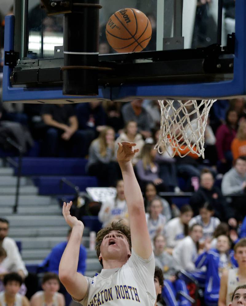 Wheaton North’s Ben Gillmar goes up for a layup during a game against Wheaton Warrenville South Wheaton on Friday, Dec. 20, 2024.