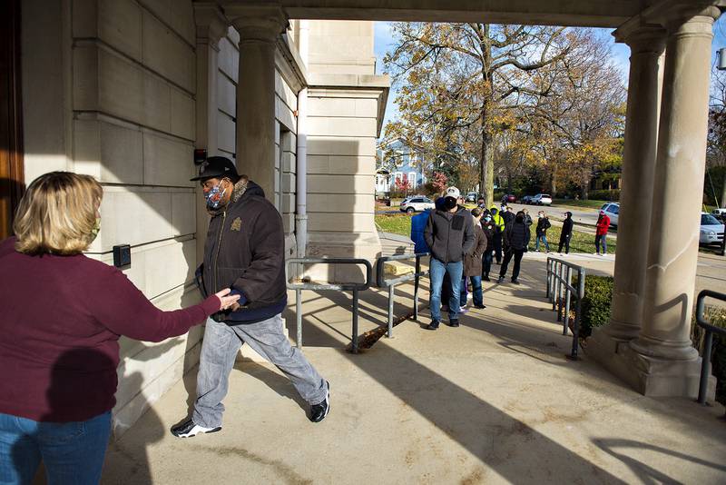 Thurman Wade (left) enters the old Lee County Courthouse in Dixon Monday afternoon to cast his early ballot ahead of Tuesday's election day.