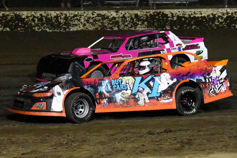 Allen Provenzano (K1) passes Steve Perkins through turns three and four during a stock car heat race at Kankakee County Speedway Wednesday, June 11, 2025.
