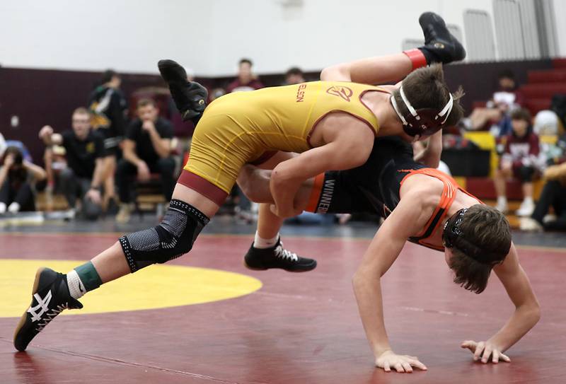 Richmond-Burton’s Lelan Nelson takes down Winnebago’s Jackson Hopkins during a126-pound match in the Tom DuBois Invite wrestling meet on Saturday, Dec. 13, 2025, at Richmond-Burton High School in Richmond.
