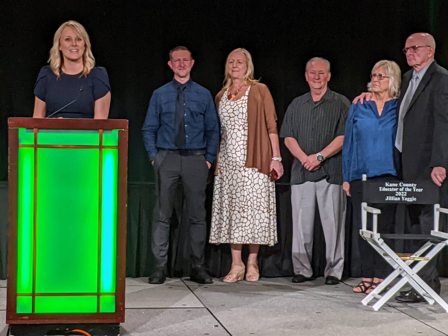 Surrounded by family, John Shields Elementary School kindergarten teacher Jillian Yaggie accepts the Kane County Educator of the Year award.