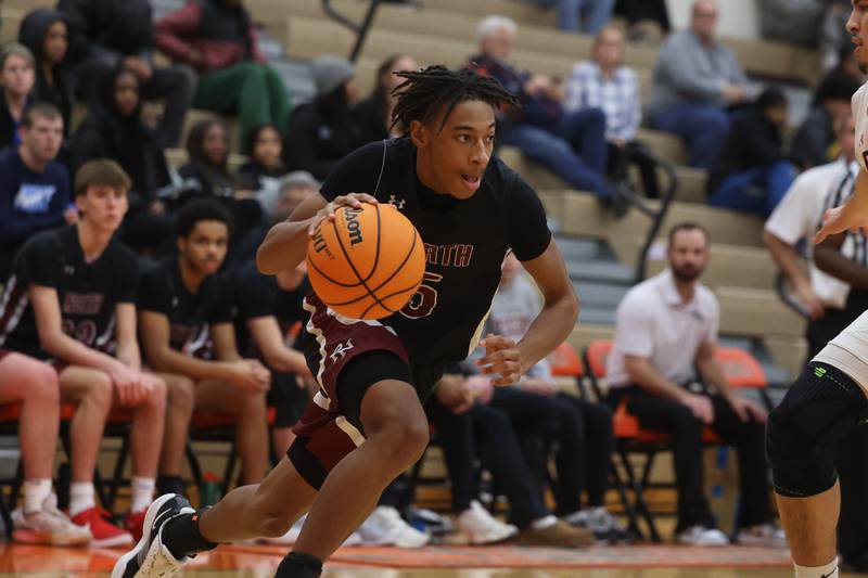 Plainfield North’s Darin Ashiru drives to the basket against Plainfield East on Tuesday, Jan 14, 2025.