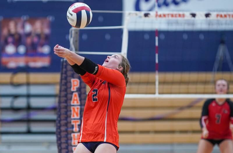 Oswego’s Grace Petasnick (2) bump sets the ball against Yorkville during a volleyball match at Oswego High School on Thursday, Sept. 14, 2023.