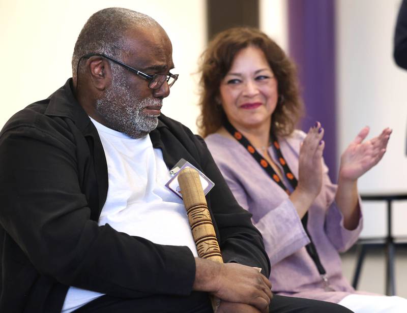 DeKalb School District 428 Superintendent Minerva Garcia-Sanchez applauds Leroy Mitchell Friday, Aug. 8, 2025, during the grand opening celebration for the school that bears his name, Dr. Leroy A. Mitchell Elementary School in DeKalb.