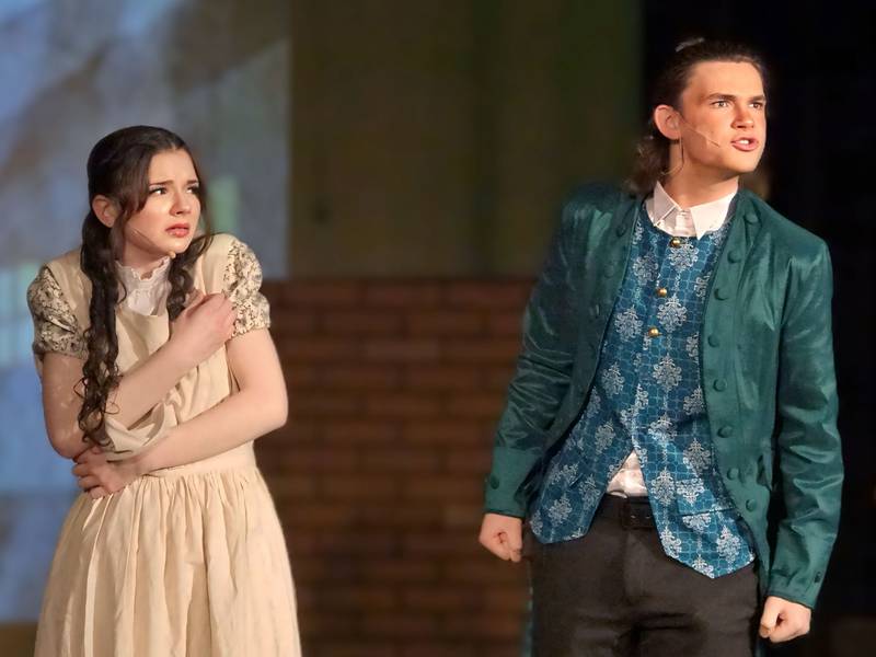 Emily Kmetz (Fantine) and James Hoehn (The Foreman) act out a scene in the musical "Les Miserabels" on Tuesday, March 13, 2024 in Matthiessen Memorial Auditorium at La Salle-Peru Township High School.