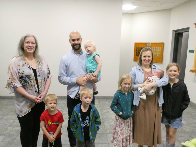 Dispatcher Jodi Kaalaas, left, helped Ben Hussey, center, and his wife, Nicole Hussey, right, with the delivery of their sixth child, John, on May 3, 2022.