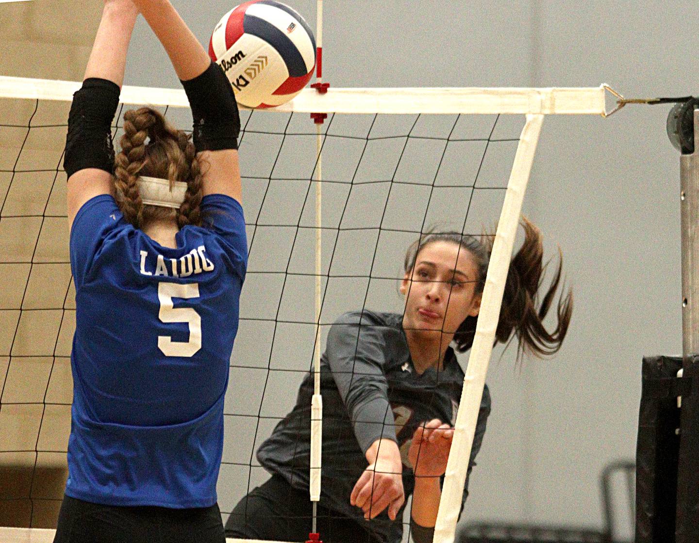 Prairie Ridge’s Maizy Agnello hits the ball against Woodstock in IHSA Class 3A sectional semifinal volleyball action at Woodstock North Monday.