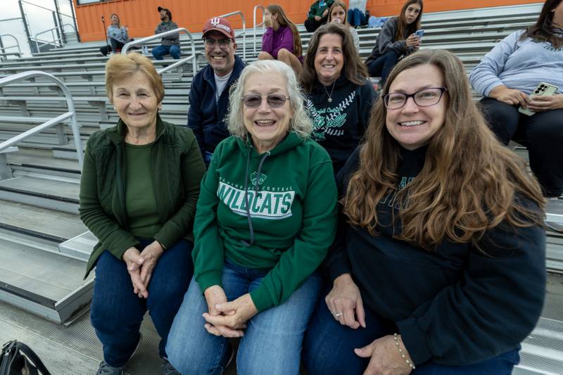 Jeremy and Judy Link (back row) and Demitra Kalantzis, Marsha Smith, and Dusty Magemeneas enjoy some fall fun cheering on Plainfield Central during the IHSA Danville Sectional varsity flag football game against Yorkville at Plainfield East on Oct. 13, 2025.