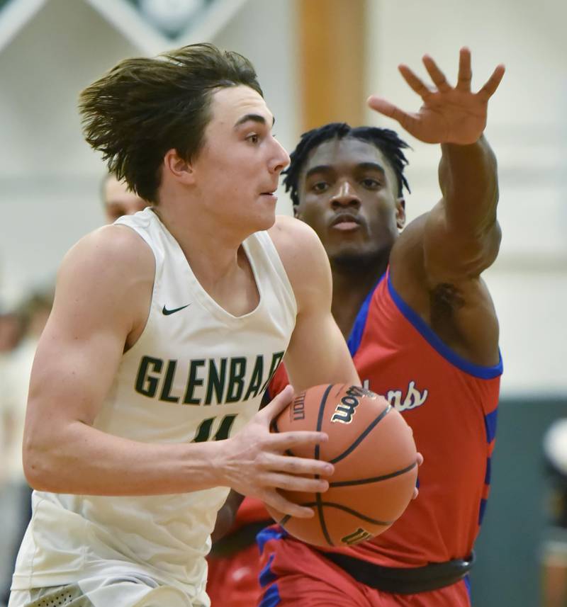 John Starks/jstarks@dailyherald.com
Glenbard South’s Jalen Brown tries to slow down Glenbard West’s Logan Brown in a boys basketball game in Glen Ellyn on Monday, November 21, 2022.