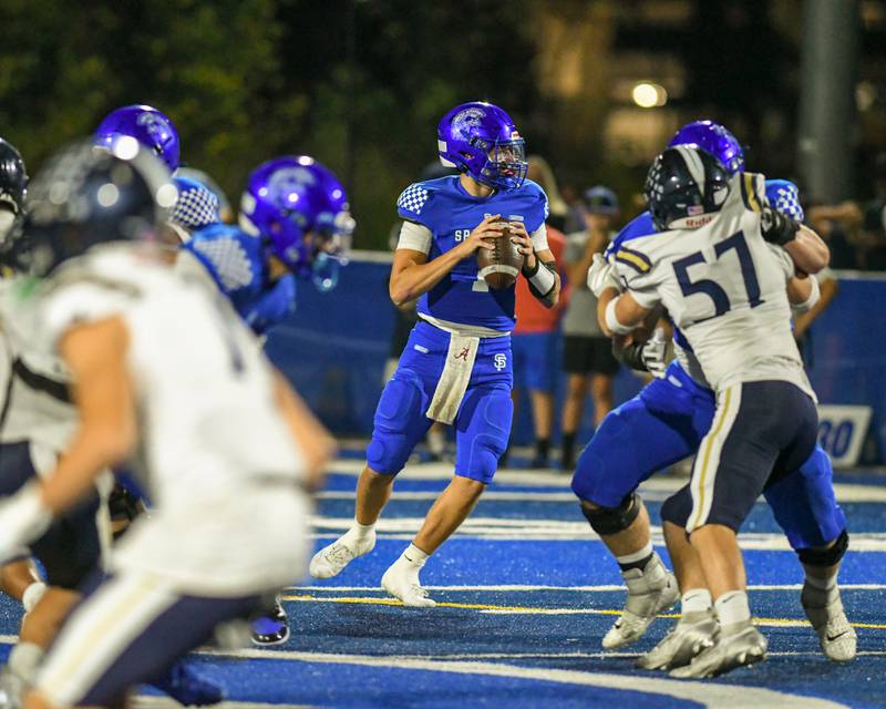 St. Francis's Brock Phillip (1) looks for a open teammate during the game on Friday Oct. 3, 2025, while taking on IC Catholic  Prep held at St. Francis.