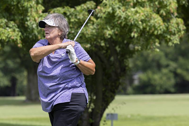 Kris Welker of Shady Oaks watches her tee shot on #5 Friday, July 11, 2025, during the 102nd annual Ladies Lincoln Highway golf tournament at Timber Creek Golf Club in Dixon.