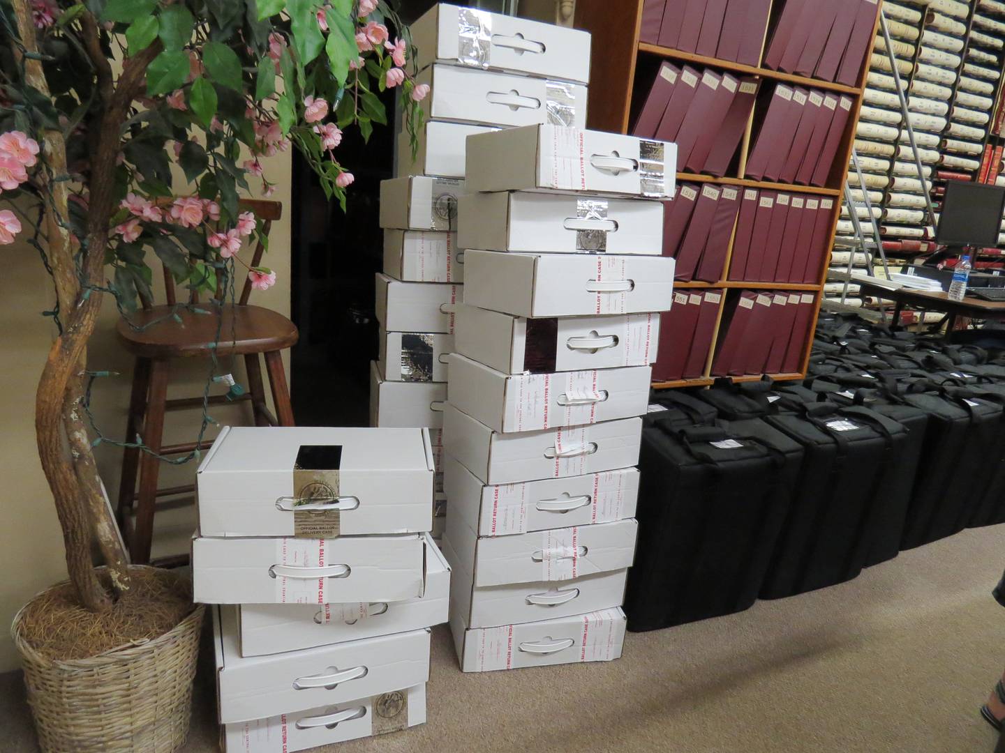 A stack of election equipment is organized on election night at Bureau County Courthouse on Tuesday, April 6.
