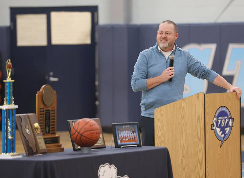Bureau Valley Storm seventh-grade girls basketball coach Ryan Rosenthal, gives a speech during a prep rally on Thursday, Dec. 11, 2025 at Bureau Valley High School in Manlius. The Storm (23-1) will meet undefeated Mt. Sterling Brown County (25-0) for the IESA Class 2A state title at 7:30 p.m tonight.