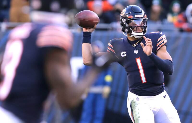 Chicago Bears quarterback Justin Fields looks for a receiver late in the fourth quarter of their game against the Green Bay Packers Sunday, Dec. 4, 2022, at Soldier Field in Chicago.