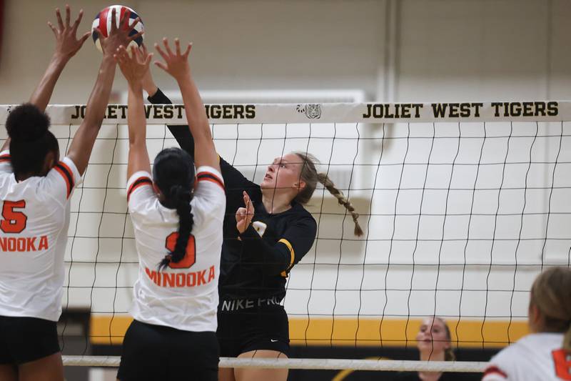 Joliet West’s Brooke Schwall pushes over a shot against Minooka on Tuesday, Sept. 26, 2023 in Joliet.