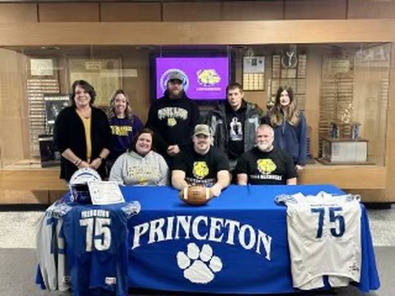 Princeton senior Payne Miller signed to play football on a full-ride school for Western Illinois University Wednesday morning. Joining Miller for his signing were (front row from left) his mother, Jenn Linsey and dad, Pau Millerl; and (back row) his aunt Carri Bonine, girlfriend Samantha Woolley, cousin Randy Dalrymple, brother-in-law RK Maloy and niece Braelyn Maloy.