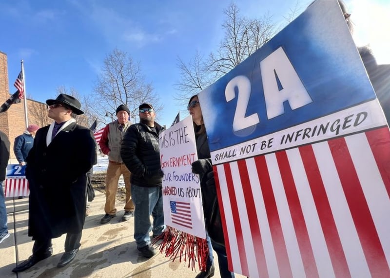 Supporters of DuPage County Sheriff Mendrick gather Tuesday outside the DuPage County administration building in Wheaton. (Brian Hill | Staff Photographer)