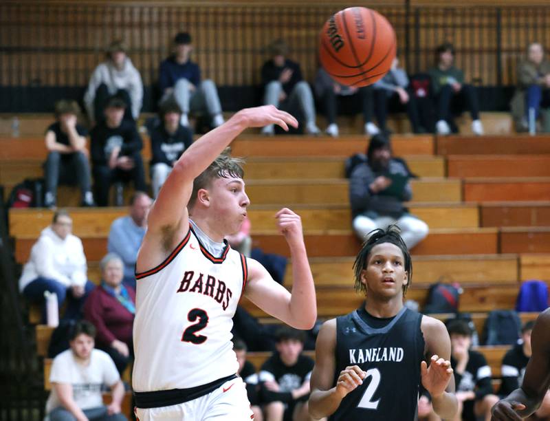 DeKalb’s Sean Reynolds saves a ball from going out of bounds in front of Kaneland's Isaiah Gipson during their game Monday, Feb. 12, 2024, at Huntley Middle School in DeKalb.