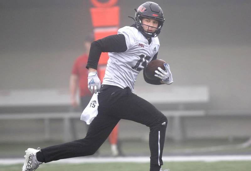 Northern Illinois University wide receiver Cole Tucker, from DeKalb, breaks away from the defense after making a catch during 11-on-11 drills at spring practice Wednesday, March 23, 2022, in Huskie Stadium at NIU in DeKalb.