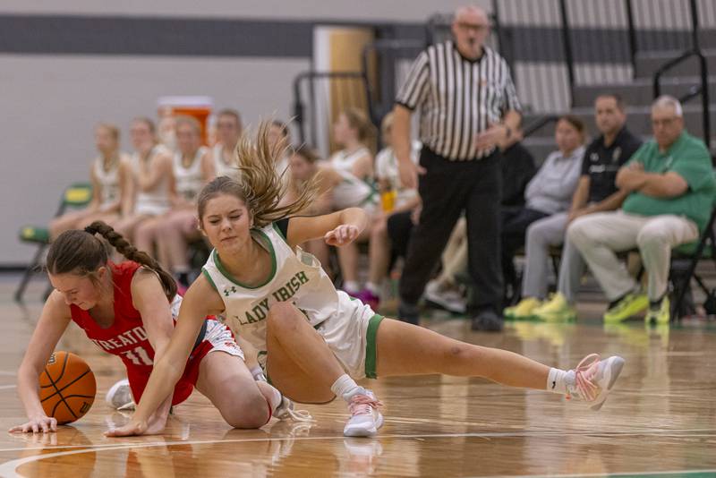 Streator's Ava Gwaltney battles Seneca's Piper Stenzel for possession of the basketball during the Falcon-Irish Girls Basketball Tournament on November 19, 2024 at Seneca High School.