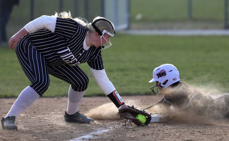 Huntley's Piper Heimbrodt steals third base as Crystal Lake Central's Logan Grams tries to tag her during a Fox Valley Conference softball game on April 7, 2026, at Crystal Lake Central High School.