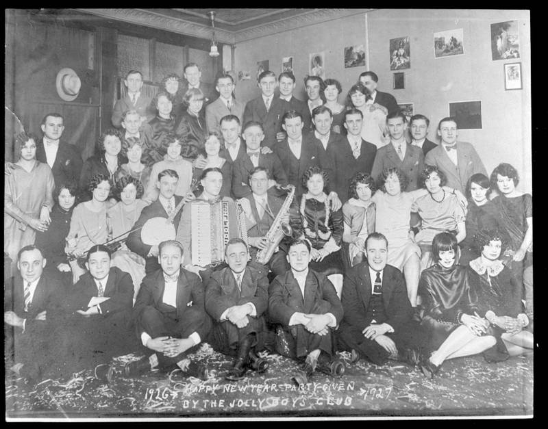 Guests pose for a photo at a New Year's Eve party hosted by The Jolly Boys Club in Joliet: 1926 to 1927.