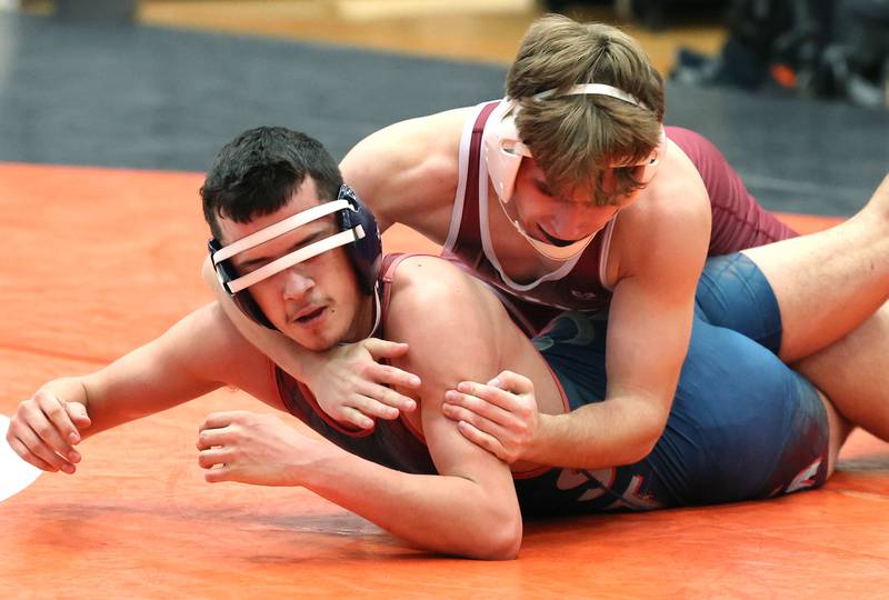 Moline’s Bradley Ledbetter controls South Elgin’s Andre Rios in a 145 pound match Wednesday, Nov. 23, 2022, during a quad at DeKalb High School.