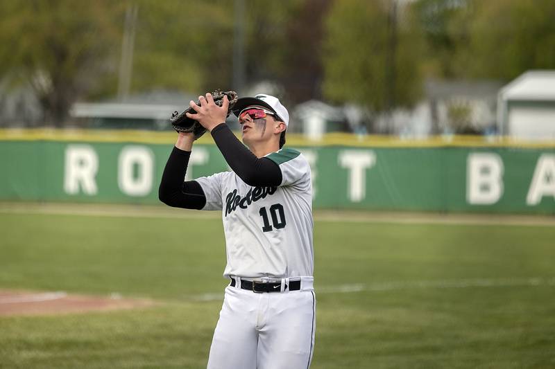 Rock Falls’ Carter Schueler puts the squeeze to a pop up against Oregon Tuesday, May 2, 2023.