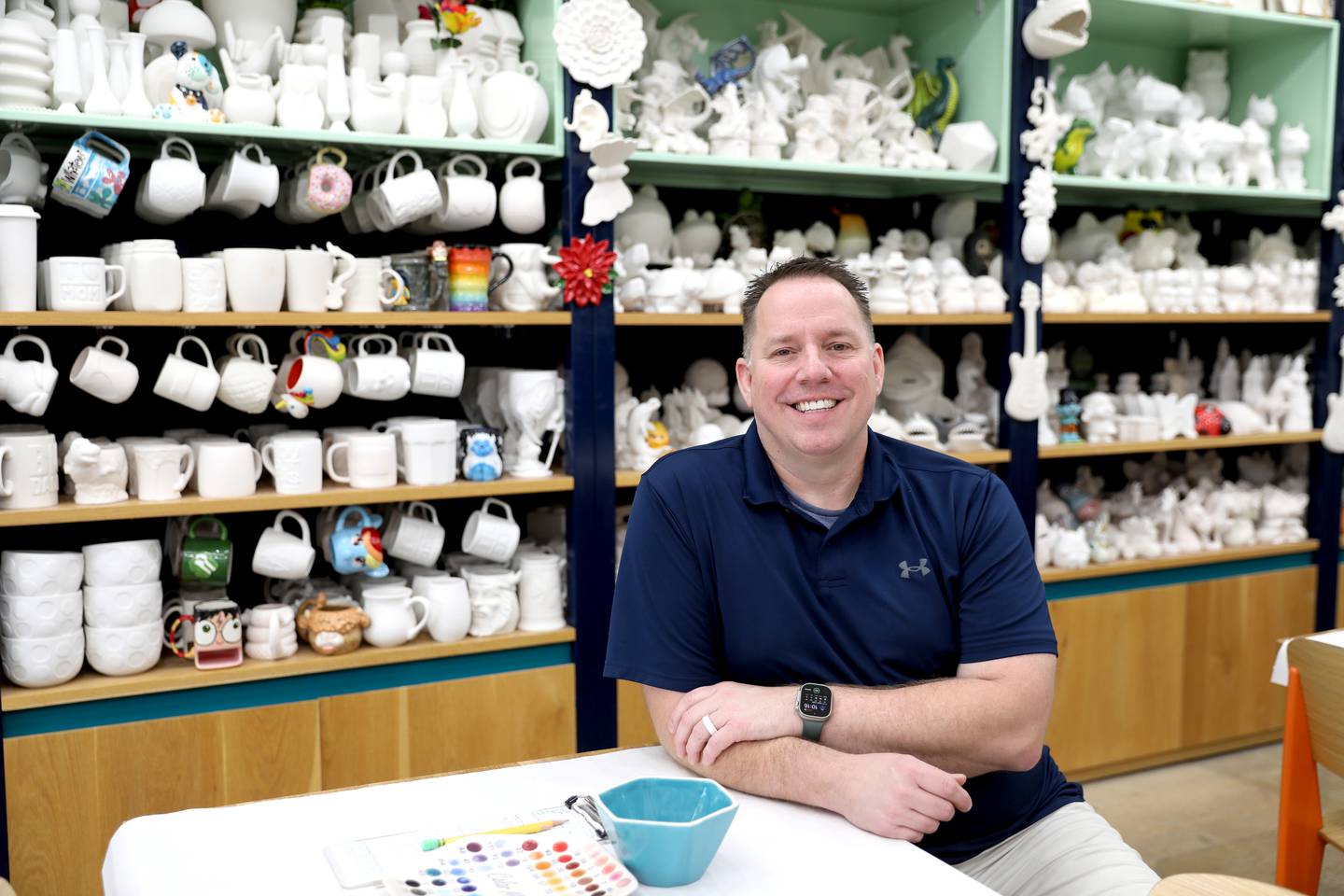 U.S. Navy veteran Jason Stucky now owns the Color Me Mine pottery studio in Geneva.