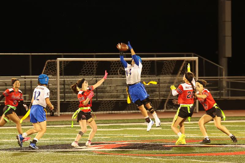 Joliet Central's Elliana Fowler catches a pass above Bradley-Bourbonnais defenders during the Boilermakers' 60-7 victory over Joliet Central in the season opener on Aug. 25, 2025.