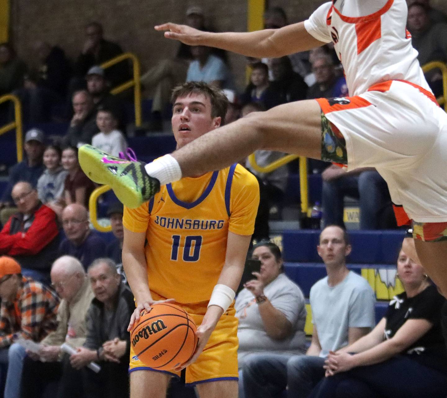 Johnsburg’s Ashton Stern waits for a flying Peoria Manual defender to pass before draining an outside shot in boys IHSA Class 2A Supersectional basketball on Monday, Mar. 9, 2026, at Sterling High School in Sterling.