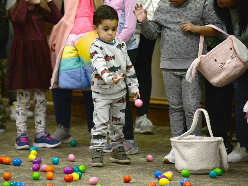 Joel Gonzalez of Downers Grove reacts to having to put back an Easter Egg until the hunt officially starts during the Downers Grove Bunny Hop Egg Hunt Friday, March 22, 2024.