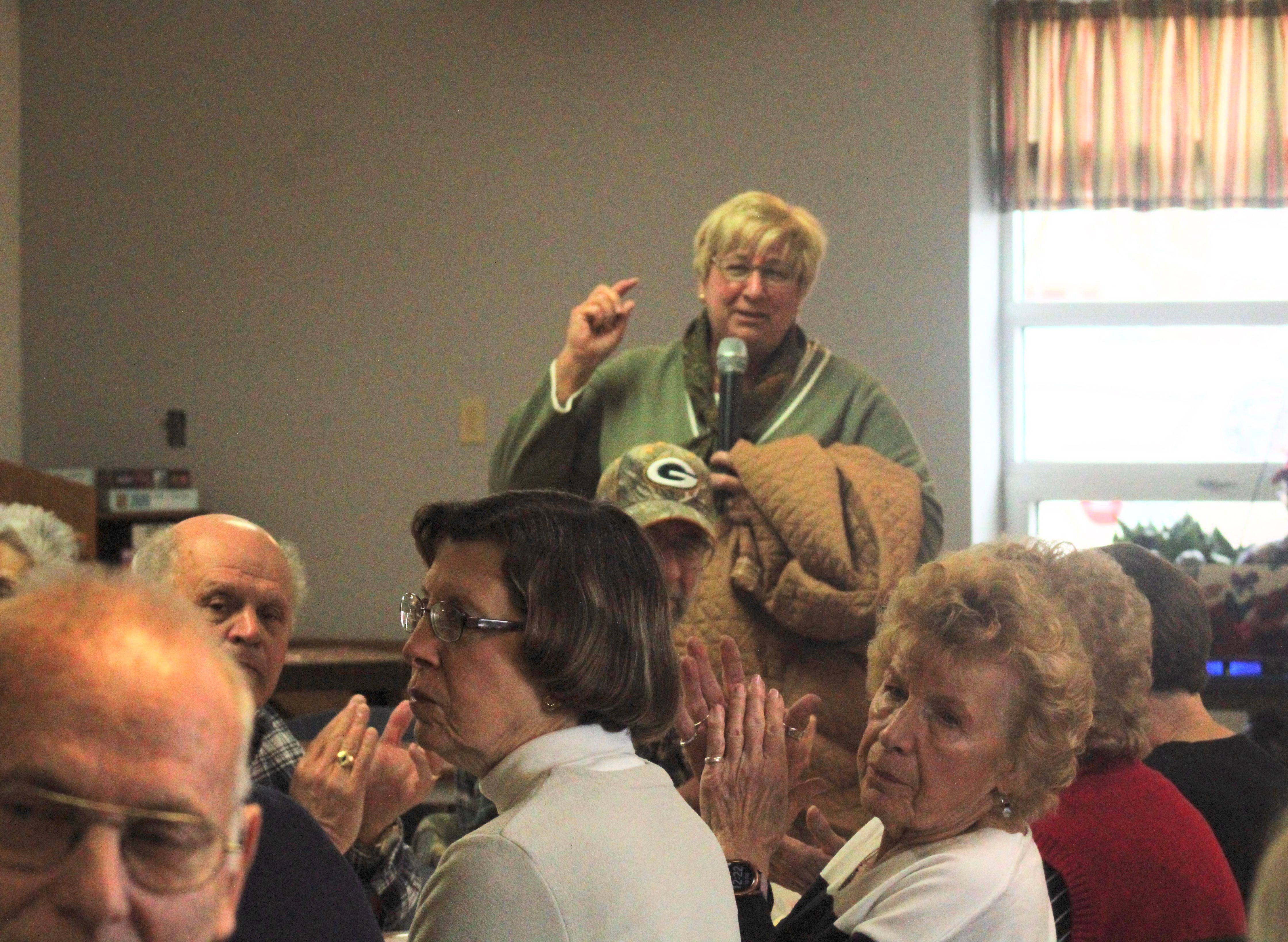 Paula Basta, director of the state Department on Aging, commends the volunteers who served the Friday, March 10, 2023 meal at the Whiteside County Senior Center, eliciting applause from the diners in attendance.