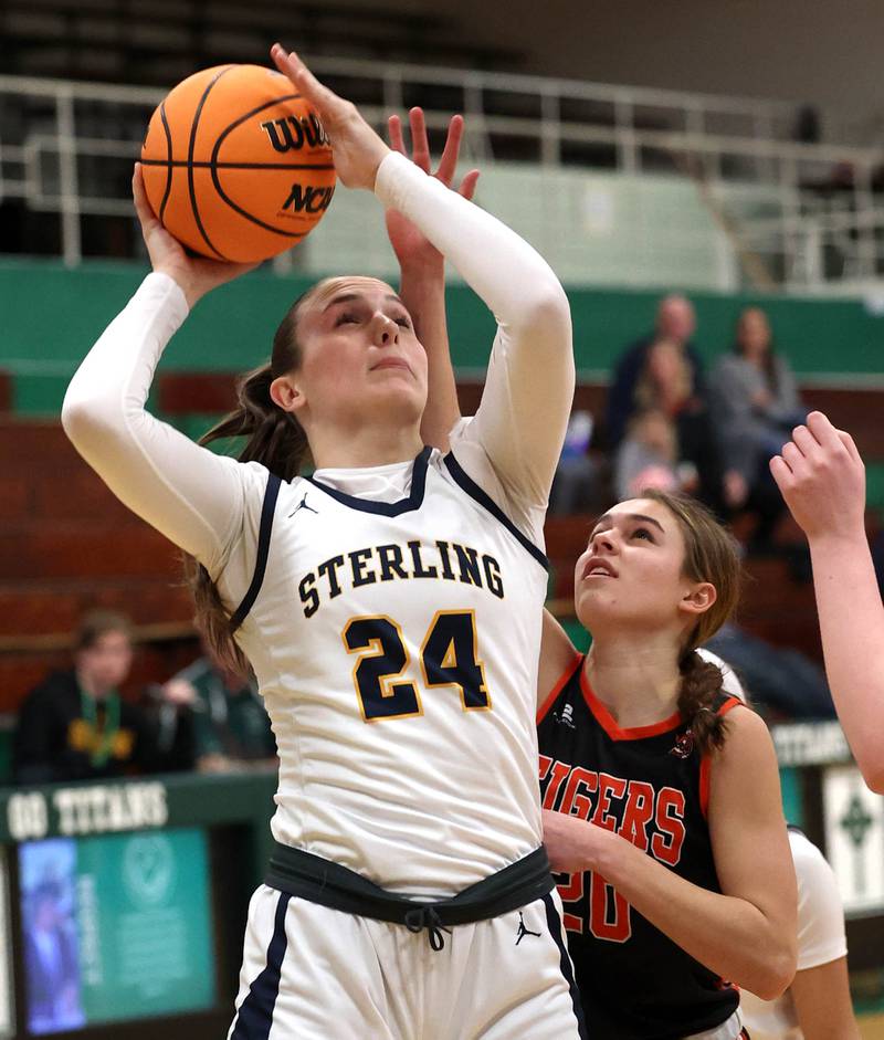 Sterling's Madison Austin gets off a shot in front of Crystal Lake Central's Hadley Ferrero during their Class 3A sectional semifinal game Tuesday, Feb. 25, 2025, at Boylan Catholic High School in Rockford.