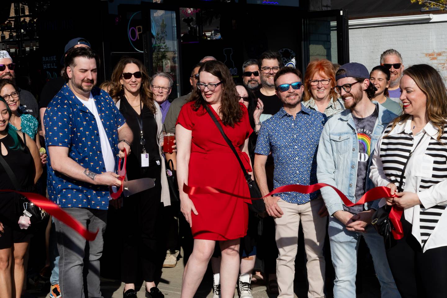 Members of the Crystal Lake Pride nonprofit celebrate the inception of the organization with a ribbon-cutting ceremony on April 23, 2026.