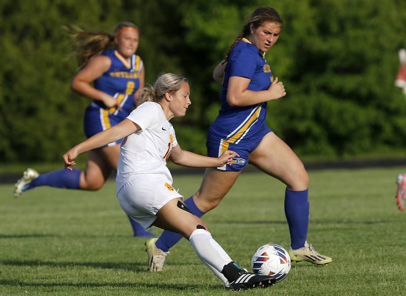 Richmond-Burton's Jordan Otto kicks the ball towards there goal as she is defended by Johnsburg's Kiara Welch during the IHSA Class 1A Marian Central Sectional Championship match on Tuesday, May 21, 2024, at Marian Central High School.