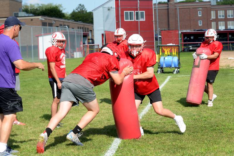 Oregon High School linemen work on blocking techniques under the direction of assistant coach John Bothe during practice on Wednesday, Aug. 13, 2025 in Oregon. The Hawks travel to Lanark for a practice game with Eastland-Pearl City on Friday, Aug. 22.