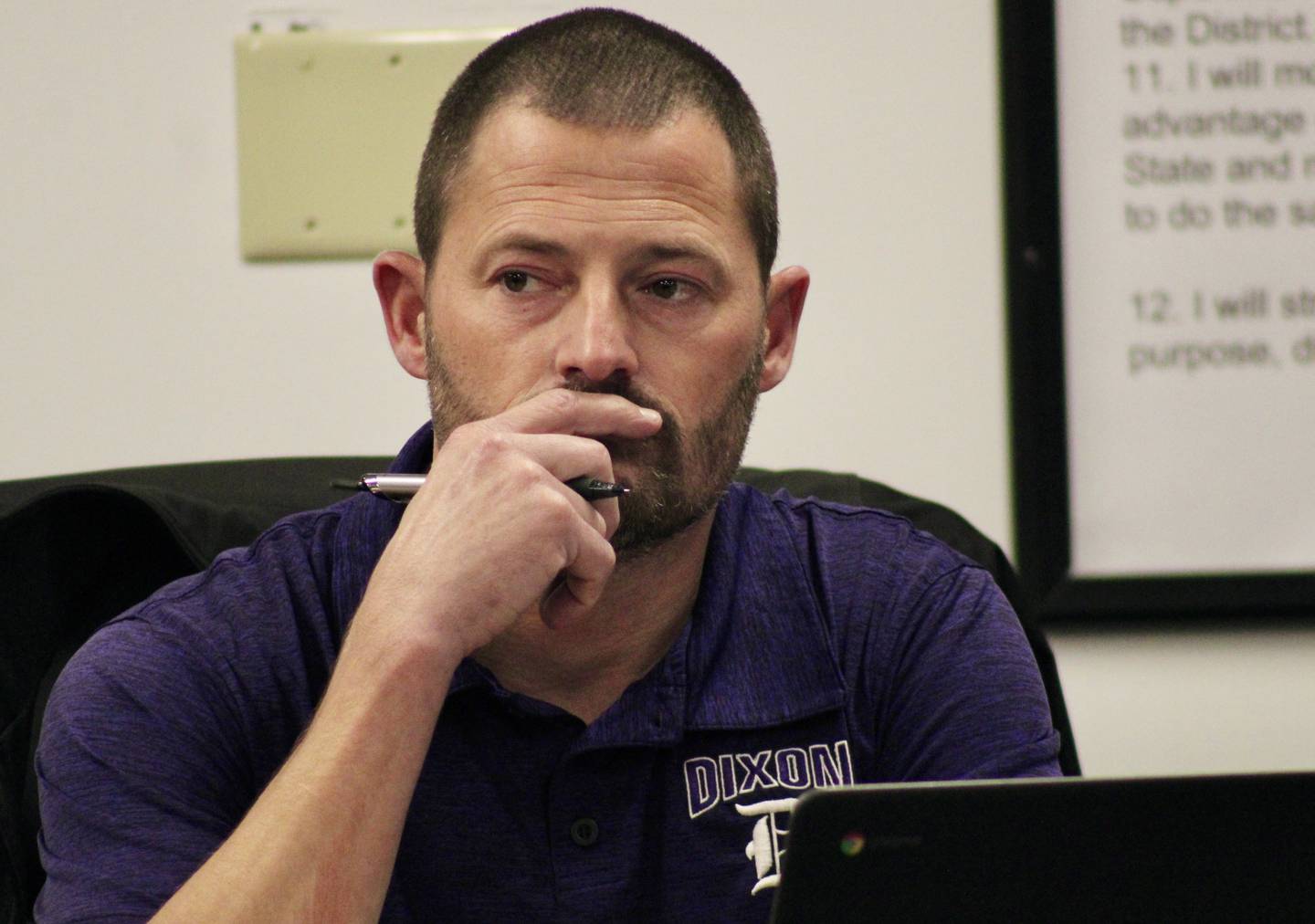 Brandon Rogers, secretary for the board of education, listens thoughtfully Wednesday, Nov. 16, 2022, during a discussion about whether Dixon Public Schools should purchase a two-year-old vehicle because of the high demand and unavailability of activity minibuses on the market.