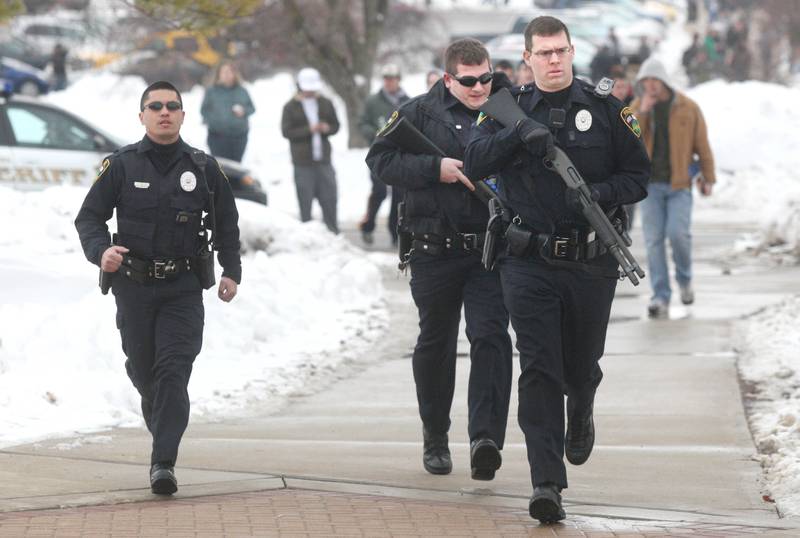 Shaw Local 2008 file photo – Tactical police forces rush to the scene of a shooting on the DeKalb campus of Northern Illinois University on Feb. 14, 2008.