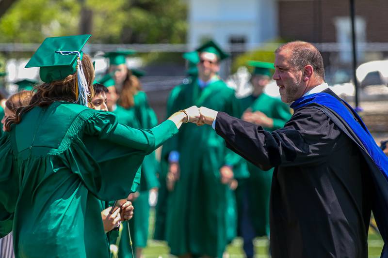 Dr Shahe Bagdasarian, Principal of York High School, greets graduates at the York High School Graduation Ceremony. May 21, 2023.