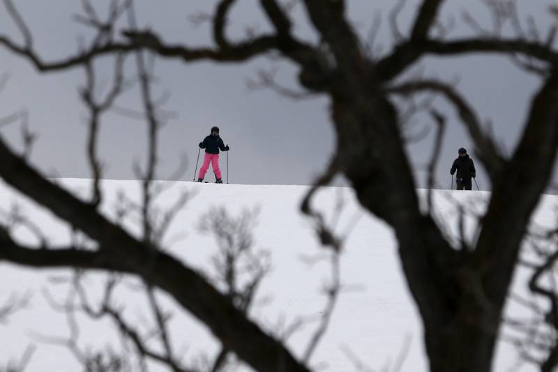 Skiers wait at the top of Wilmot Mountain Ski Resort on Thursday, Jan. 16, 2025, to make a run.