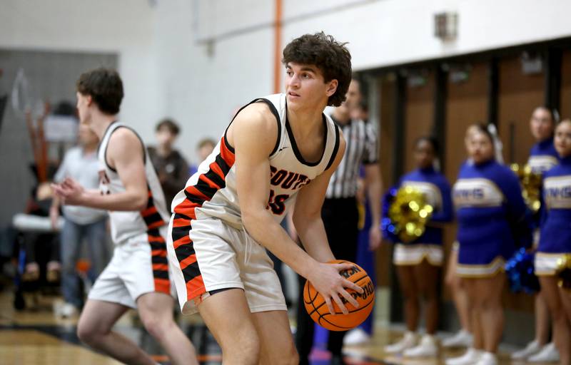 Wheaton Warrenville South's Luca Carbonaro looks to pass the ball during a game against Wheaton North on Friday, Feb. 7, 2025 in Wheaton.