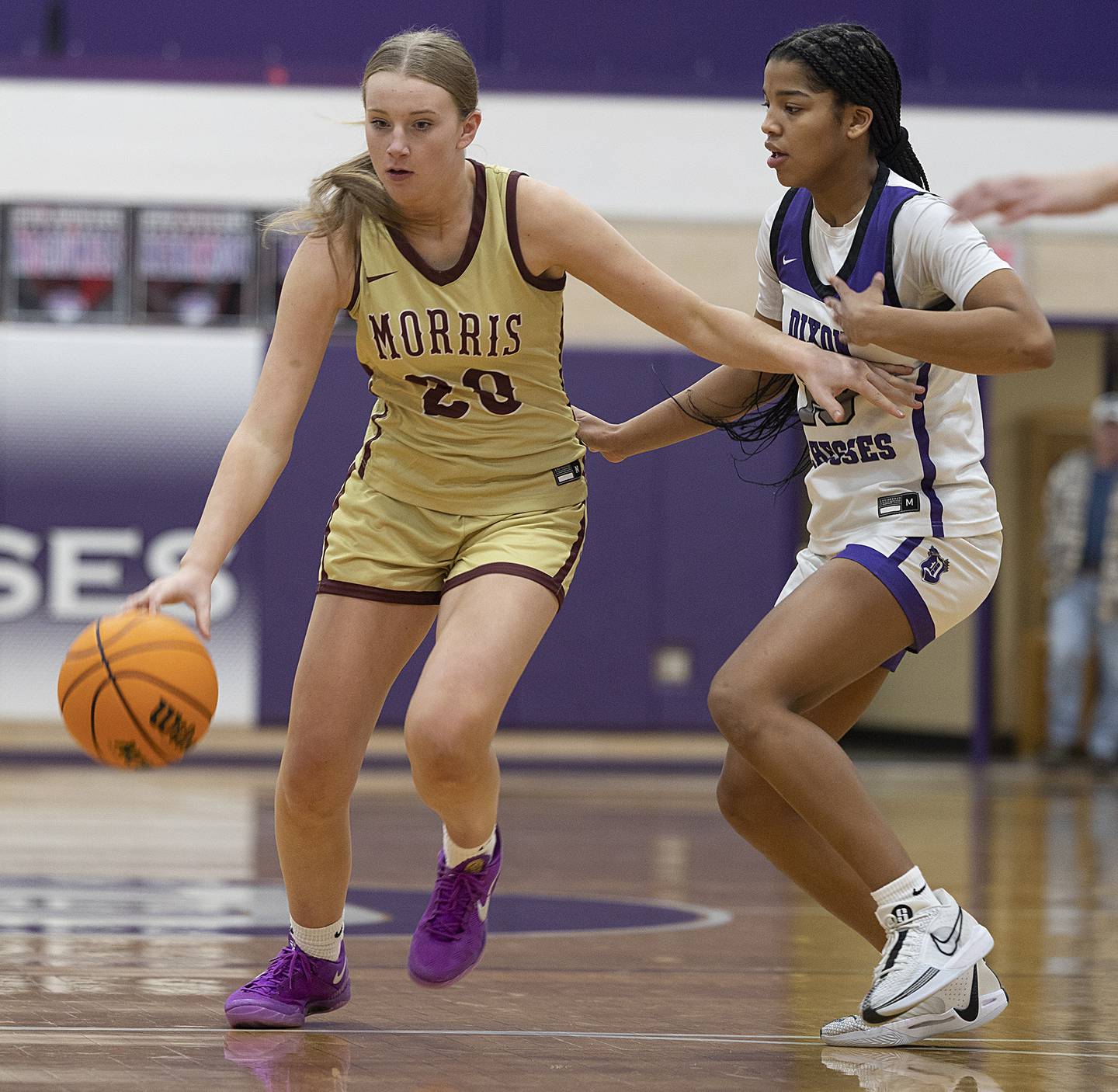 Morris’ Landrie Callahan brings the ball up court against Dixon's Ahmyrie McGowan Friday, Jan. 3, 2025, at Dixon High School.