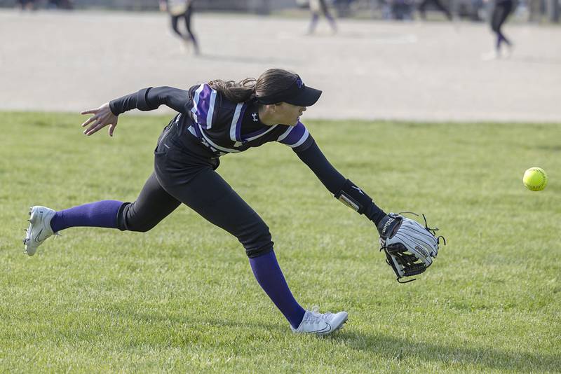 The ball slips by Dixon’s Brooklyn Arjes in left field against Rock Falls Thursday, May 7, 2026.