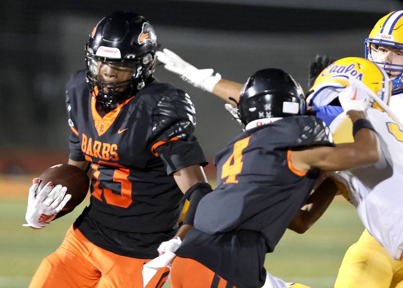 DeKalb’s Davon Grant carries the ball during their game against Sandburg Friday, Sept. 8, 2023, at DeKalb High School.