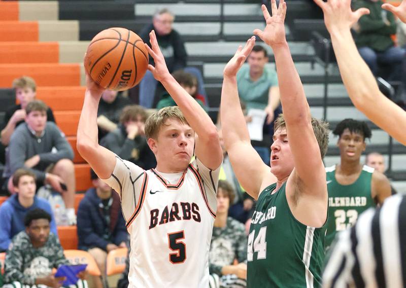 DeKalb's Tyler Vilet looks for somebody to get open as he is stopped on the baseline by Glenbard West's Jack Oberhofer during their game Tuesday, Nov. 29, 2022, at DeKalb High School.