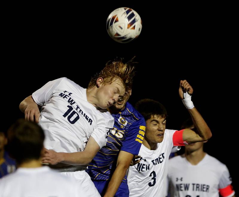 New Trier's Aidan O'Neill heads the ball away from Lyons Township's Jimmy Brejcha during the IHSA Class 3A state championship soccer match on Saturday, Nov. 4, 2023, at Hoffman Estates High School.