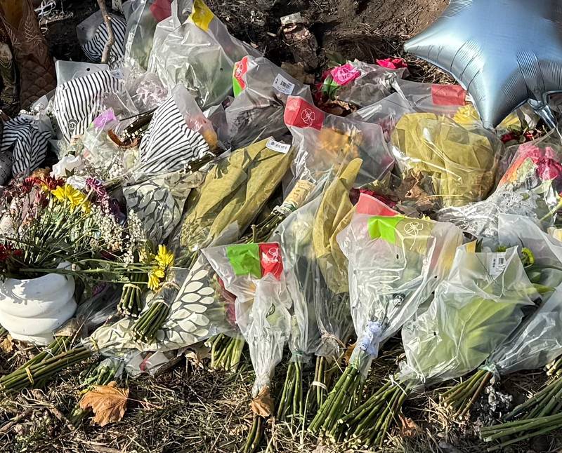 A makeshift memorial is in place Tuesday, Oct. 29, 2024, at the site of a crash that claimed three lives near Woodstock two days before.